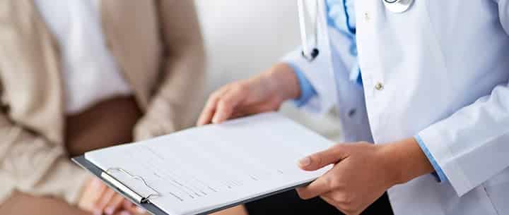 doctor reading papers