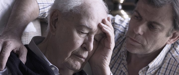 Elderly man being comforted, illustrating support in the Asbestos Diseases Guide