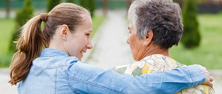 younger and older woman talking