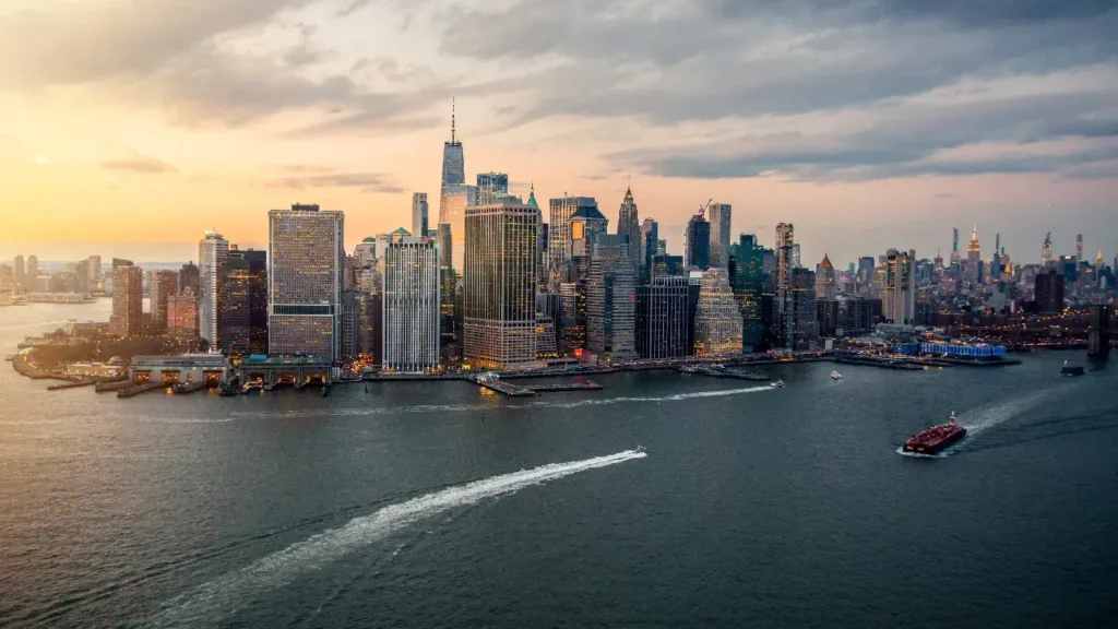 The Manhattan skyline illuminated by sunset, representing strength and support for mesothelioma patients in New York