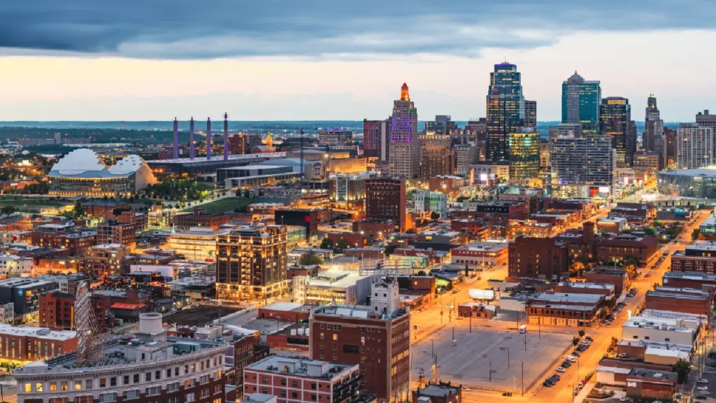 A dusk view of Kansas City, Kansas, showcasing the skyline and vibrant colors of the evening sky