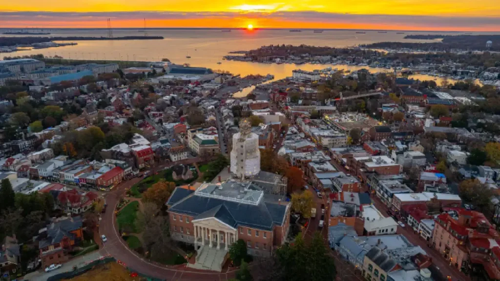 The sun sets over Virginia, illuminating the city in vibrant orange and pink