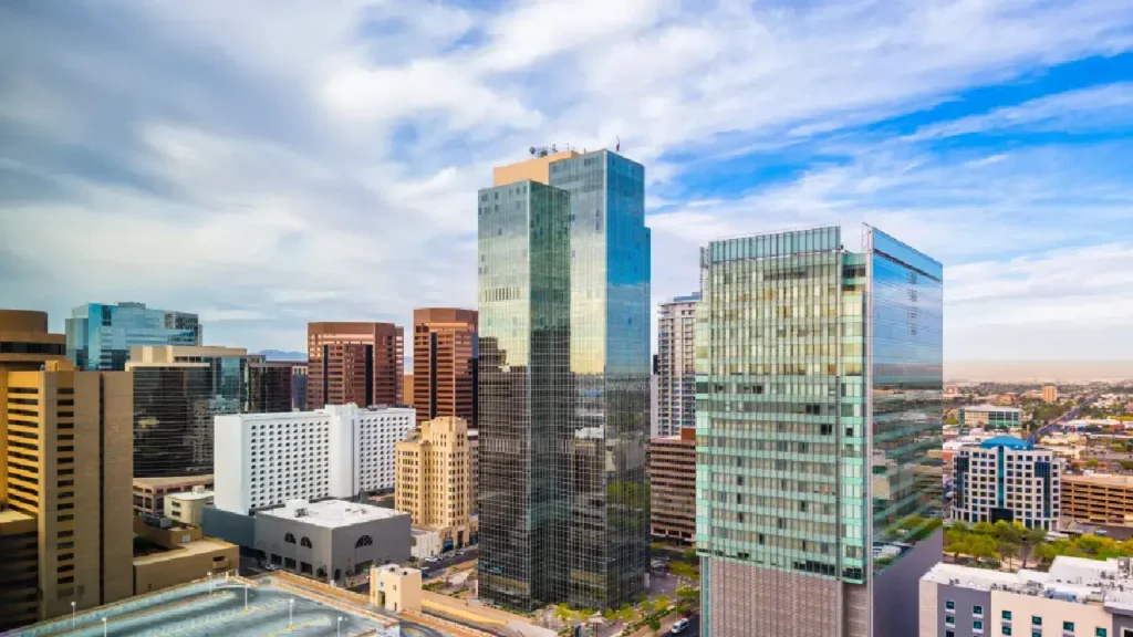 Phoenix urban skyline with business buildings and desert mountains, symbolizing Arizona's legal landscape for mesothelioma lawyers.
