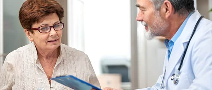 doctor talking to woman