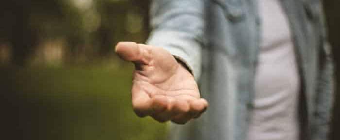 Man holding out his hand