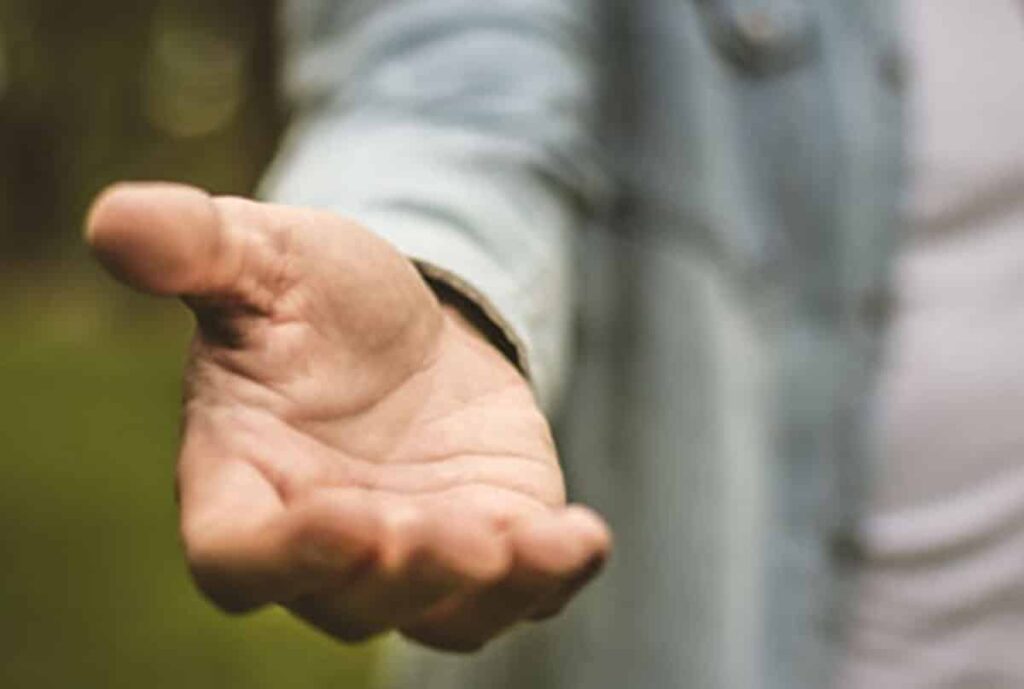man holding out his hand