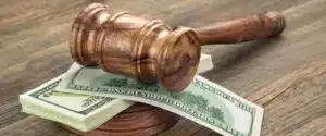gavel on top of money