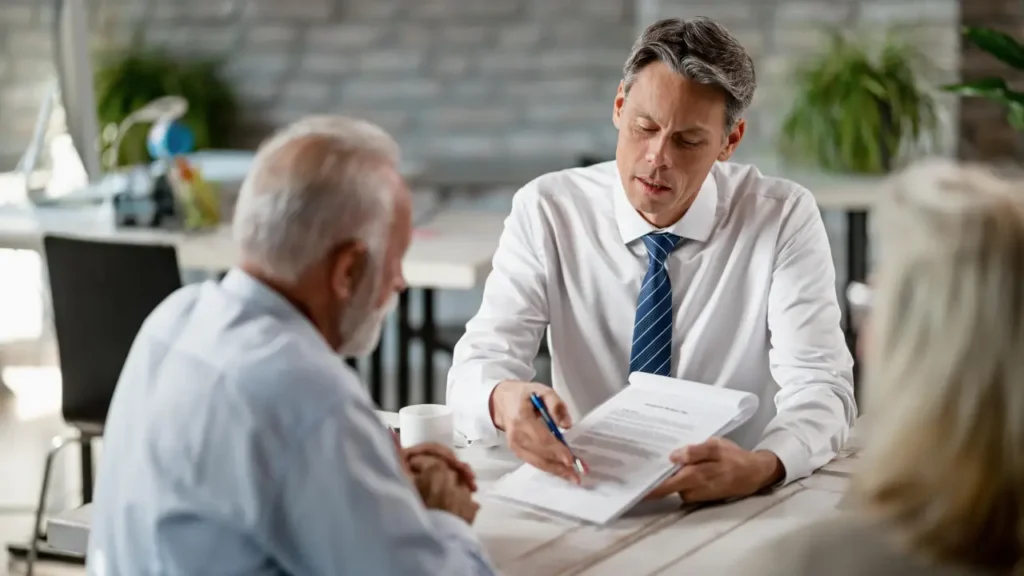 Two men discuss, one in a suit, showcasing a mesothelioma lawyer's support for a victim