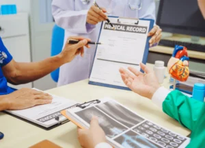 Doctor holding medical chart with lung scan visible