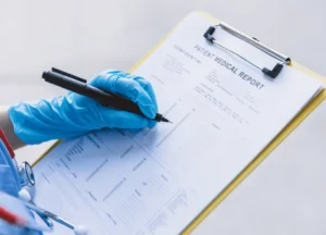 Medical report doctor reviewing lung X-ray linked to asbestos exposure.