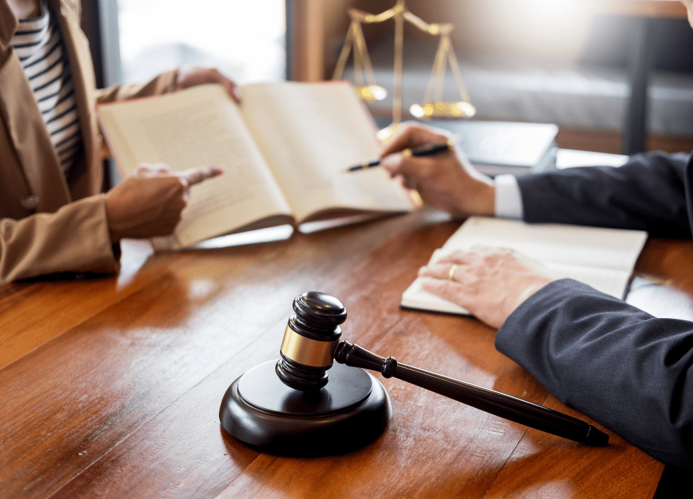 Lawyer consulting with a client in an office about an asbestos claim